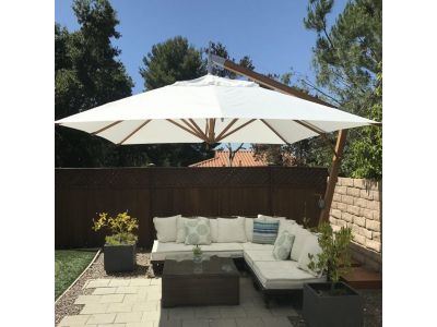 wooden cantilever parasol over a patio table in a garden