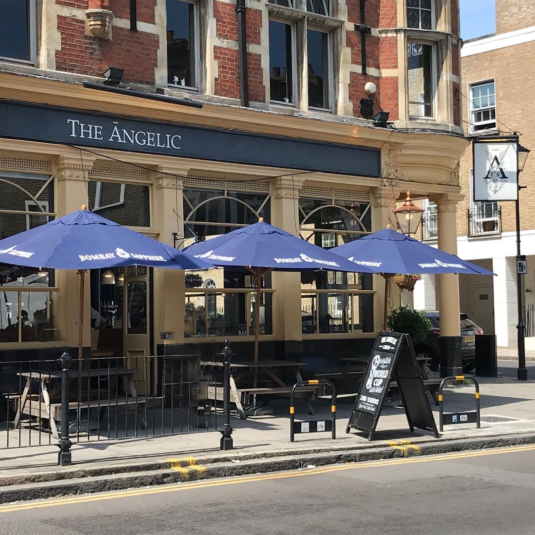 restaurant printed parasols on sidewalk